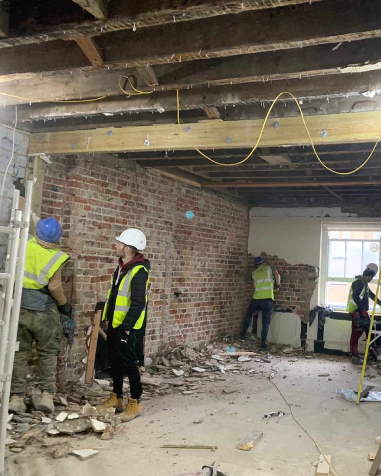 The house stripped back to brick walls and timber joists