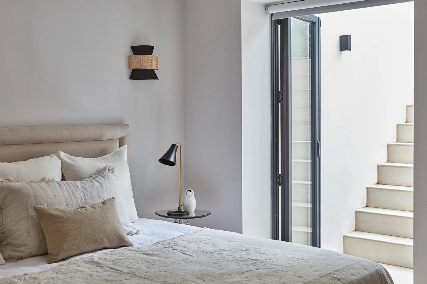 A basement bedroom beside the lightwell stair